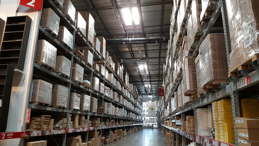 a warehouse interior with goods neatly organized on racks