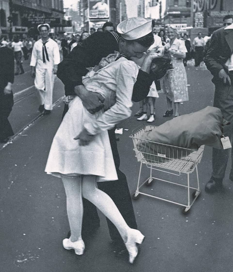 WWWII-era photo of a US sailor and a woman kissing on the street